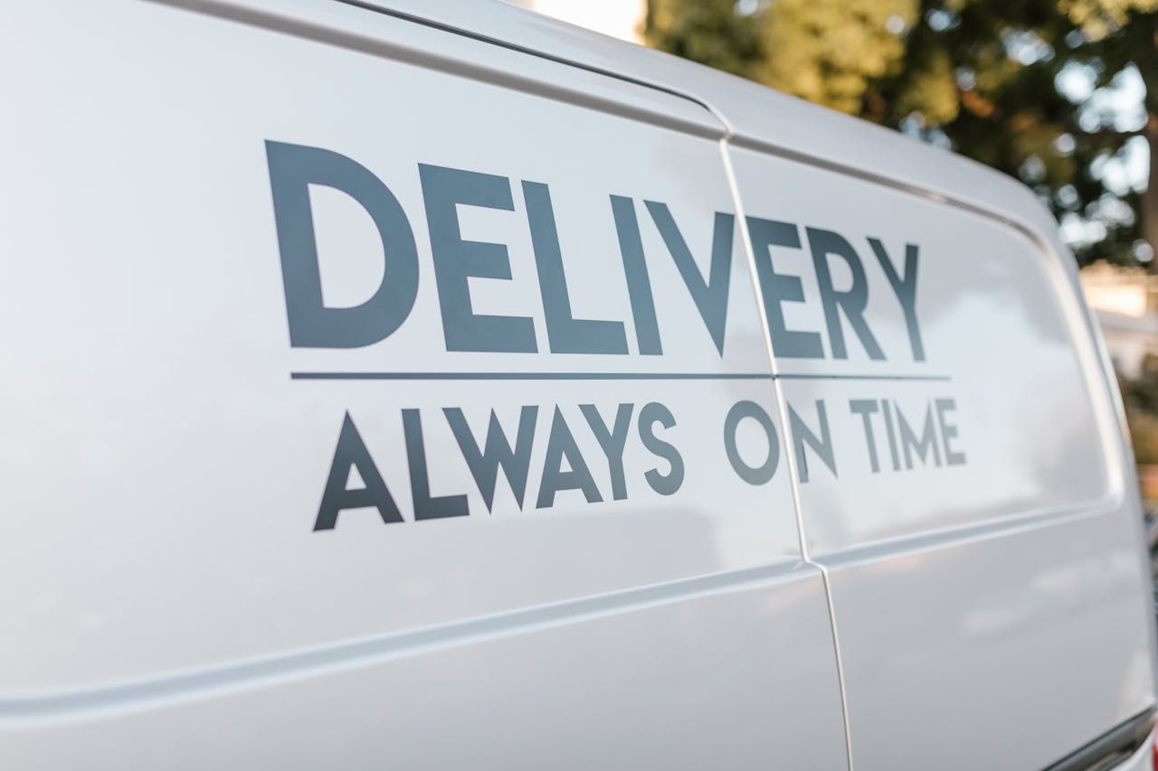 about-us Close-up of delivery van with slogan 'Always On Time' emphasizing timely service.